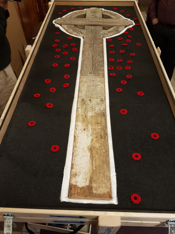 The cross was decorated with Canadian poppies before leaving for France