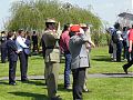 Australian and German soldiers salute the Australian National Anthem